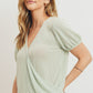 Textured knit surplice bottom string short sleeve top